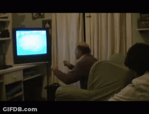 A Man Is Playing A Video Game On A Sony Tv GIF