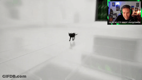 A Man Is Playing A Video Game With The Words Zooming Behind Him GIF
