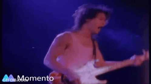 A Man Is Playing An Electric Guitar In Front Of A Blue Background That Says Momento GIF
