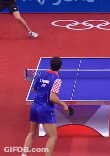 A Man Is Playing Ping Pong And Has The Number 5 On His Shirt GIF