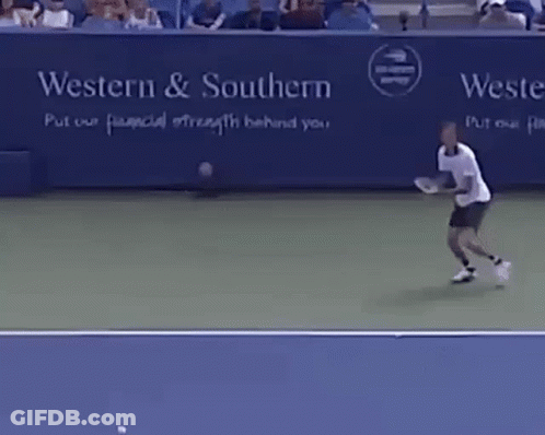 A Man Is Playing Tennis In Front Of A Sign That Says Western & Southern Put Our Financial Strength Behind You GIF