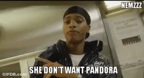 A Man Is Pointing At A Sign That Says `` She Don T Want Pandora '' . GIF