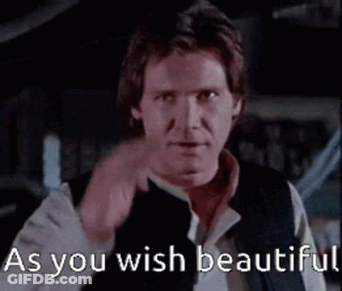 A Man Is Pointing At The Camera With The Words As You Wish Beautiful Behind Him GIF