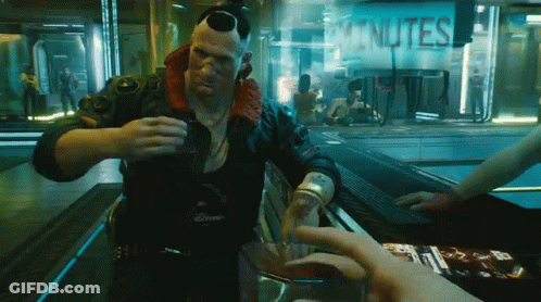 A Man Is Pouring A Drink In Front Of A Sign That Reads Minutes GIF