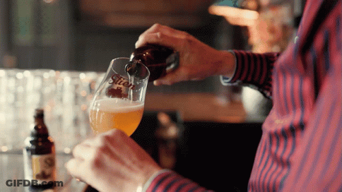 A Man Is Pouring Beer Into A Glass That Says Stiek GIF