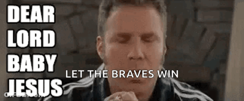 A Man Is Praying With His Eyes Closed In Front Of A Sign That Says Dear Lord Baby Let The Braves Win Jesus GIF