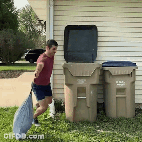 A Man Is Pushing A Garbage Can That Has The Number 04 60573 On It GIF