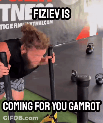 A Man Is Pushing A Sled With The Words Coming For You Gamrot On The Bottom GIF
