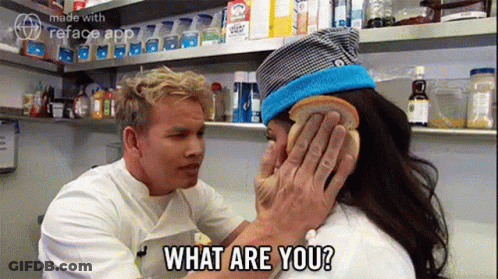 A Man Is Putting A Piece Of Bread On A Woman 'S Ear And Asking What Are You ? GIF
