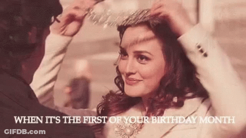 A Man Is Putting A Tiara On A Woman . GIF