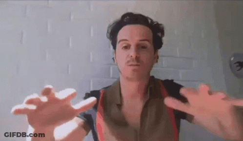 A Man Is Reaching Out His Hands Towards The Camera . GIF