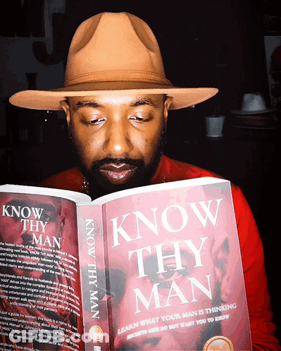 A Man Is Reading A Book Titled Know Thy Man GIF