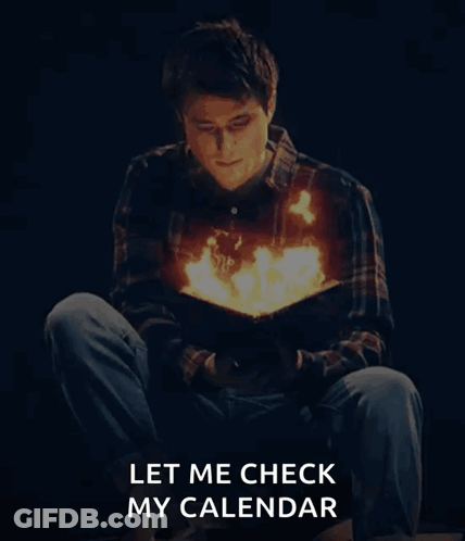 A Man Is Reading A Book With Fire Coming Out Of His Chest GIF