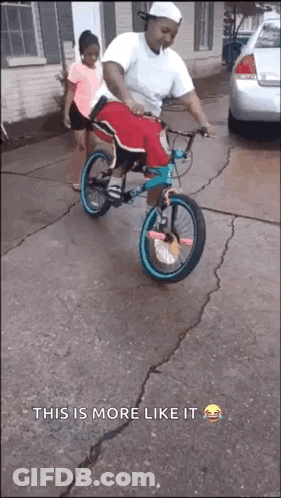 A Man Is Riding A Bike With A Little Girl On The Back And The Caption " This Is More Like It " GIF