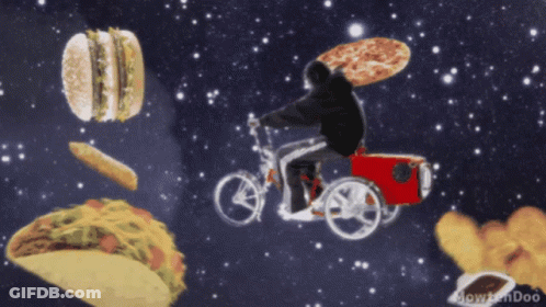 A Man Is Riding A Bike With A Pizza On His Back Surrounded By Food GIF