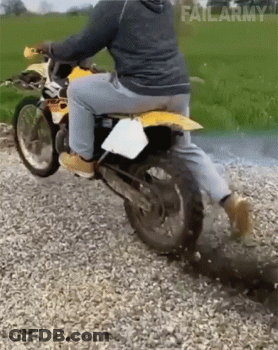 A Man Is Riding A Dirt Bike On A Gravel Road With Failarmy Written On The Bottom Right GIF