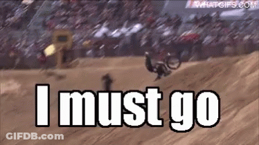 A Man Is Riding A Dirt Bike On A Track And The Words I Must Go Are Visible GIF