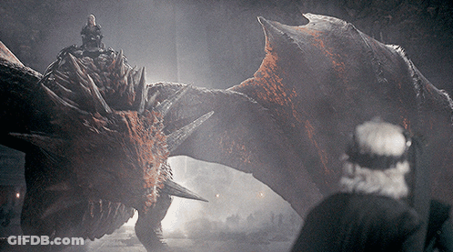 A Man Is Riding A Dragon In A Dark Room GIF