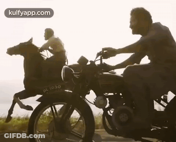 A Man Is Riding A Horse On A Motorcycle . GIF
