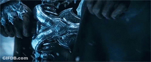 A Man Is Riding A Horse With A Sword In His Hand In The Snow . GIF