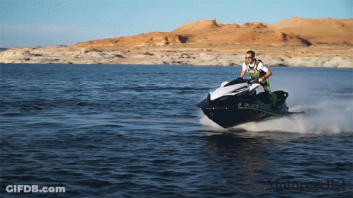 A Man Is Riding A Jet Ski On A Lake With Mountains In The Background And A License Plate That Says O Chl GIF
