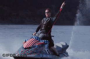 A Man Is Riding A Jet Ski With A License Plate That Says Cf 3812 Rn975 GIF