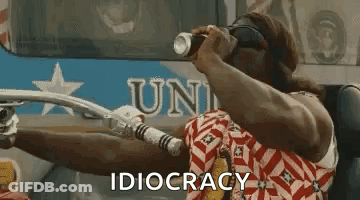 A Man Is Riding A Motorcycle And Holding A Can Of Soda In His Hand . GIF