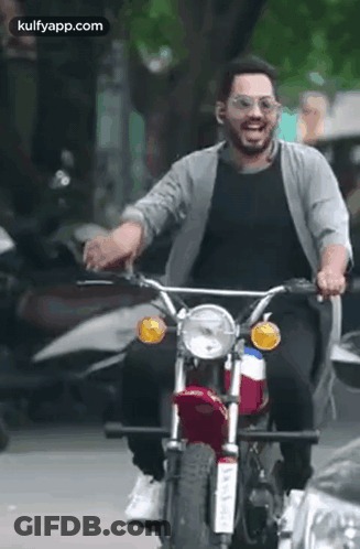 Man Riding Motorcycle Wearing Sunglasses GIF
