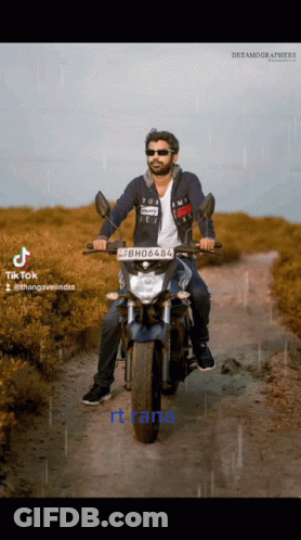 A Man Is Riding A Motorcycle With A License Plate That Says Bh06488 GIF