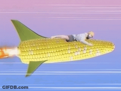 A Man Is Riding A Rocket Made Out Of Corn On The Cob . GIF
