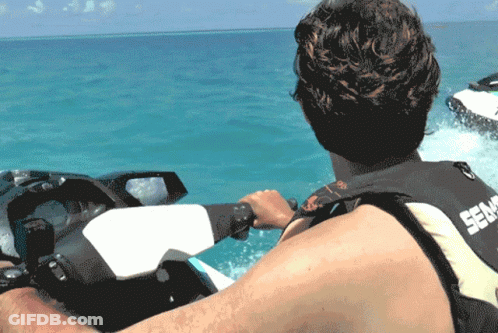 A Man Is Riding A Sea Doo Jet Ski In The Water GIF
