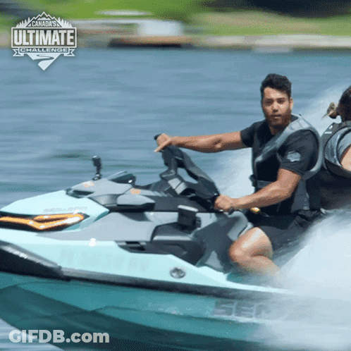 A Man Is Riding A Sea Doo Jet Ski In The Water With The Ultimate Challenge Logo Behind Him GIF