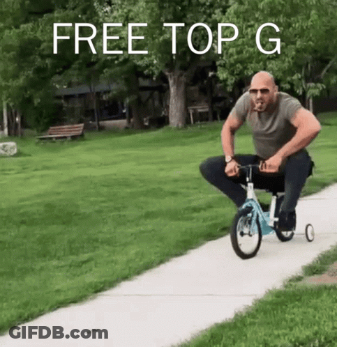A Man Is Riding A Tricycle On A Sidewalk With The Words Free Top G Written Above Him GIF