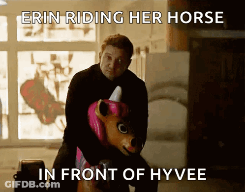 A Man Is Riding A Unicorn In Front Of A Sign That Says " Erin Riding Her Horse In Front Of Hyvee " GIF