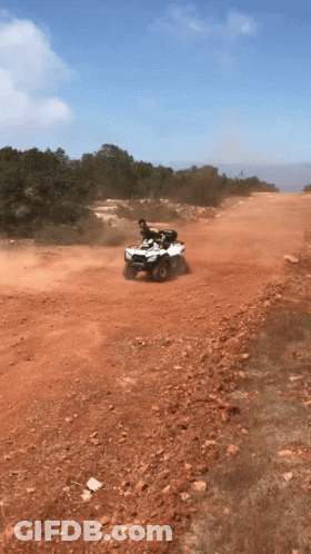 Man Riding White ATV On Dirt Road GIF