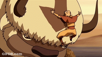 A Man Is Riding On The Back Of A Bison With Horns . GIF