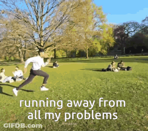 A Man Is Running Away From All His Problems In The Park GIF
