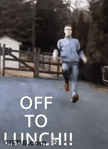 A Man Is Running Down A Road With The Words Off To Lunch GIF