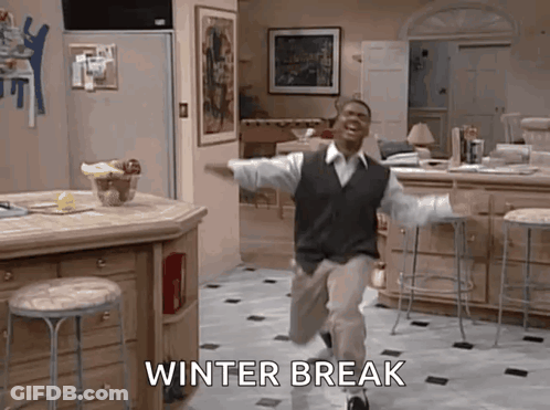 A Man Is Running In A Kitchen With The Words Winter Break Written On The Floor Behind Him . GIF