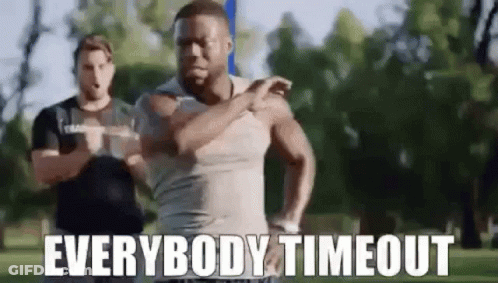 A Man Is Running In A Park With The Words `` Everybody Timeout '' Written On It . GIF
