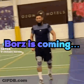 A Man Is Running On A Court With The Words ' Borz Is Coming ' Written On It GIF