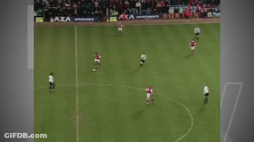 A Man Is Running On A Soccer Field In Front Of A Banner That Says Citizen GIF