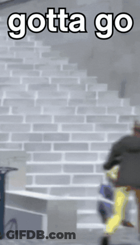 A Man Is Running Up A Set Of Stairs With The Words Gotta Go Below Him GIF