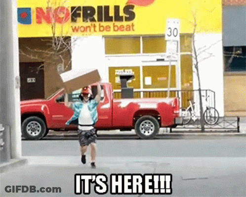 A Man Is Running With A Cardboard Box In Front Of A No Frills Sign GIF