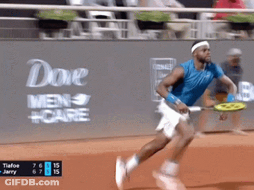 A Man Is Running With A Tennis Racquet In Front Of A Dove Men Care Ad GIF