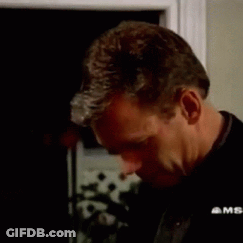 A Man Is Saying `` I 'M A Gonna Lick You '' In A Dark Room . GIF