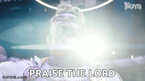 A Man Is Saying Praise The Lord With His Eyes Closed GIF