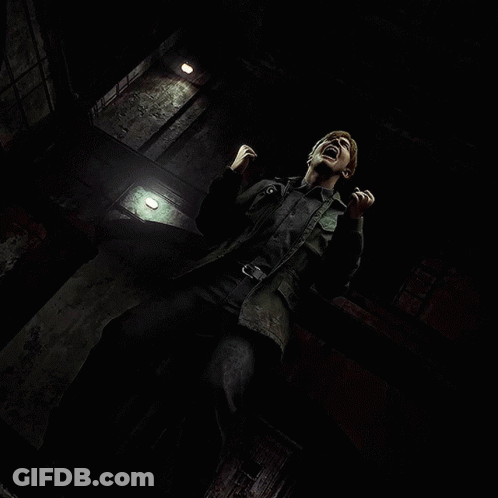 A Man Is Screaming In A Dark Room With A Light On The Wall GIF