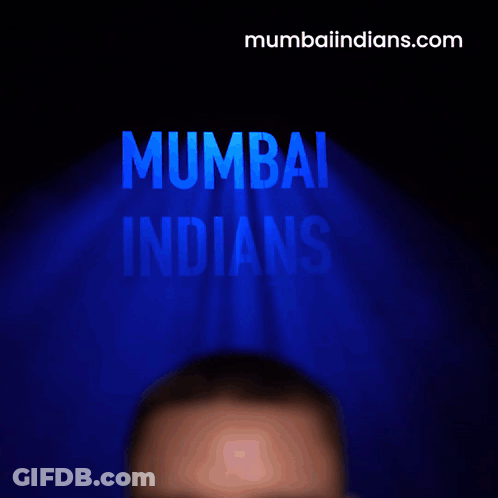A Man Is Screaming In Front Of A Mumbai Indians Logo GIF