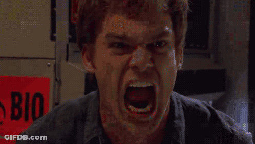 A Man Is Screaming In Front Of A Red Sign That Says Bio On It GIF